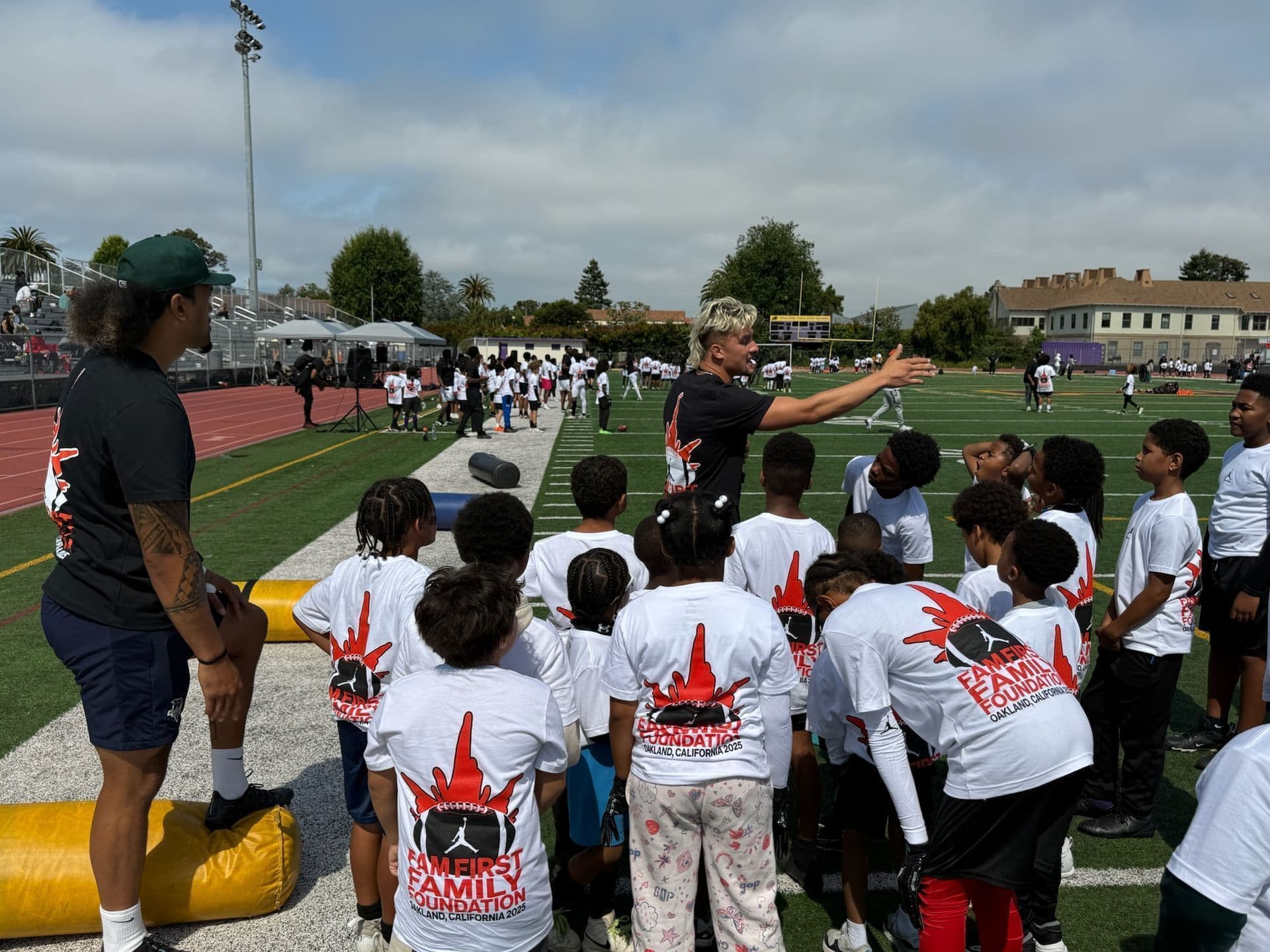 Full squad running a station-based team tackle clinic